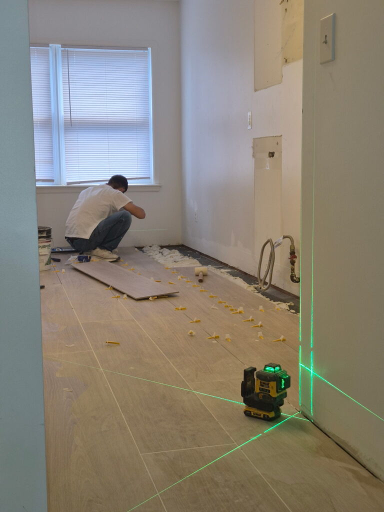 New Jersey kitchen‑remodel, installing new floor tiles after demolition