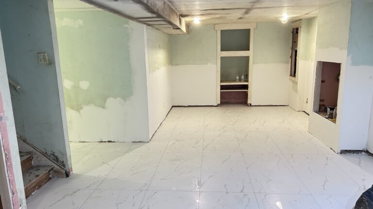 Finished new tile floors and cement baseboards after basement remodeling in New Jersey