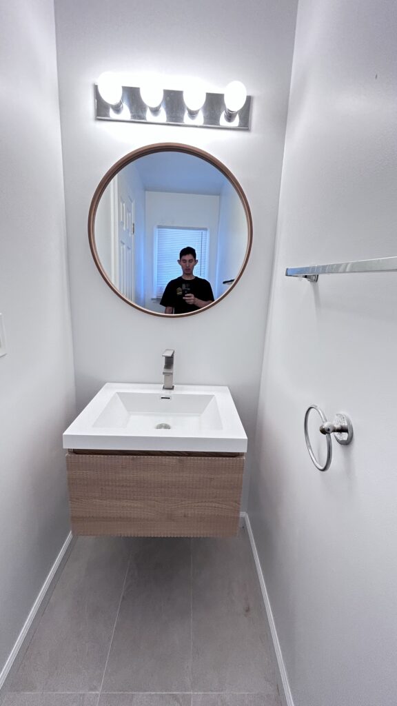Before and after photo‑old floor‑standing bathroom cabinet replaced with wall‑hung floating vanity, New Jersey bathroom remodel by Zhong's Remodel