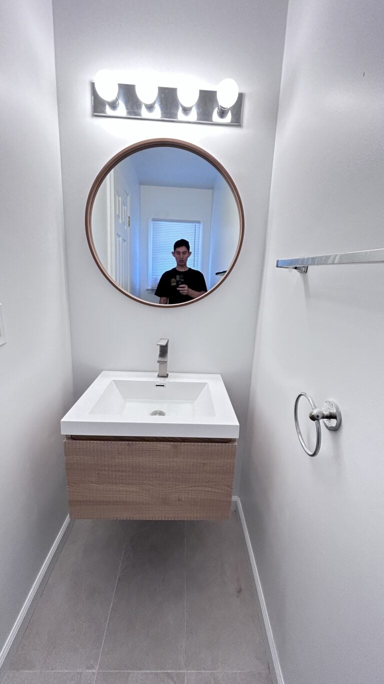 Before and after photo‑old floor‑standing bathroom cabinet replaced with wall‑hung floating vanity, New Jersey bathroom remodel by Zhong's Remodel