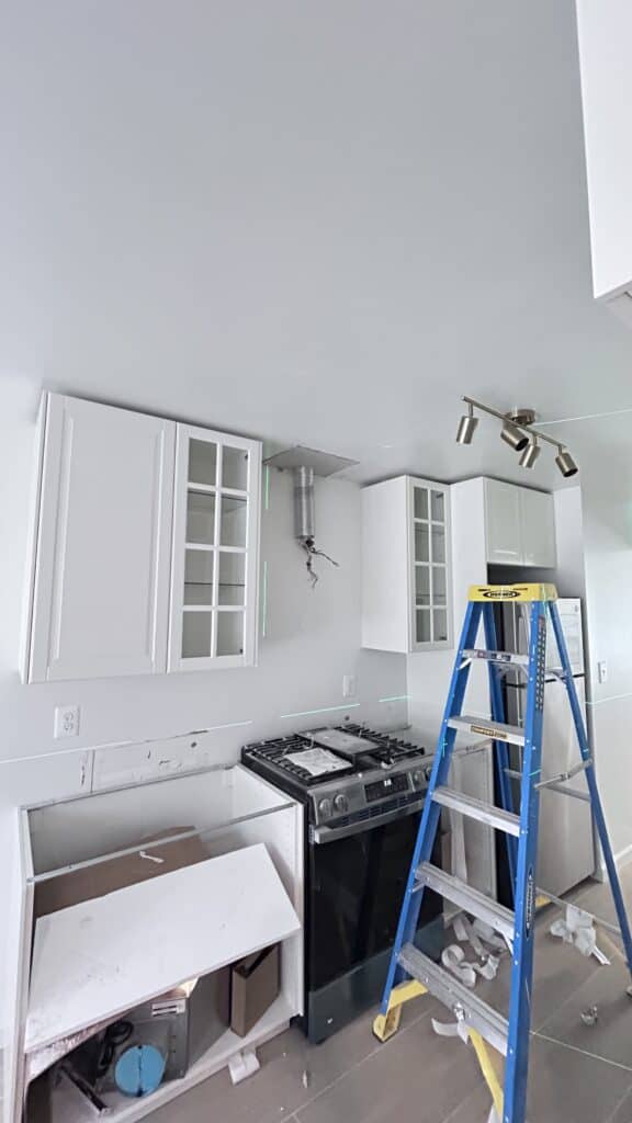New Jersey kitchen remodel, installing cabinets after floor tile installation, serviced by Zhong's Remodel
