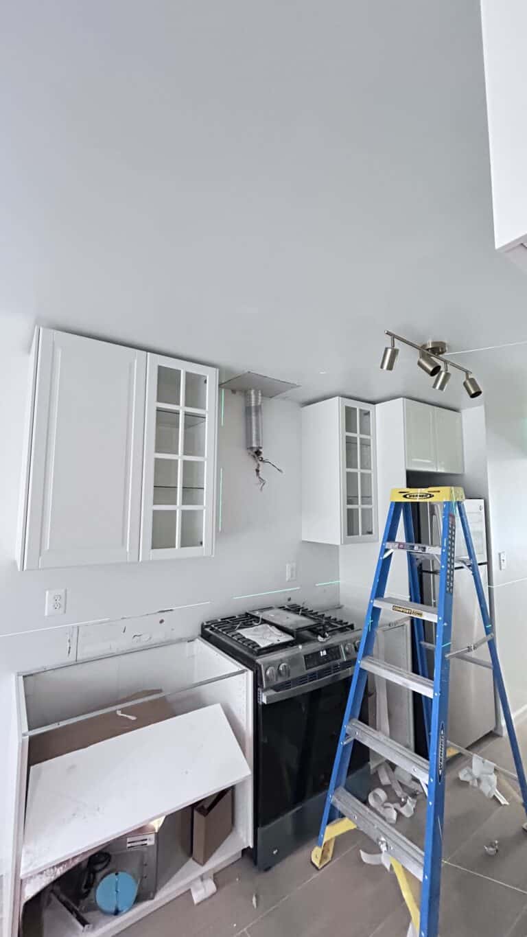 New Jersey kitchen remodel, installing cabinets after floor tile installation, serviced by Zhong's Remodel